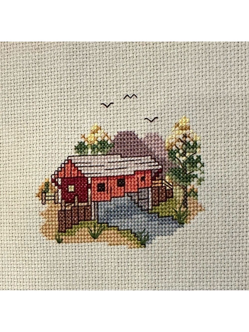 Counted Cross-Stitch completed 8”x12” panel of a Covered Bridge